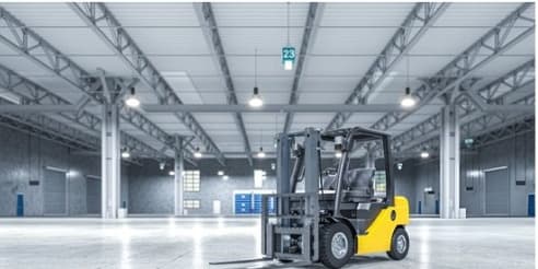 Counterbalance forklift inside an empty warehouse